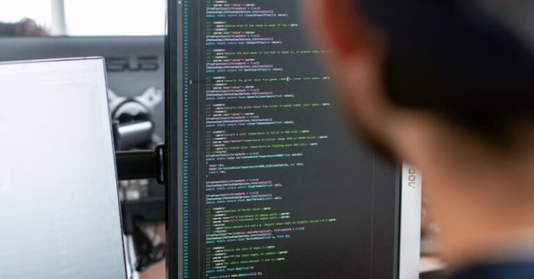 Coding - Man in Black Shirt Sitting in Front of Computer