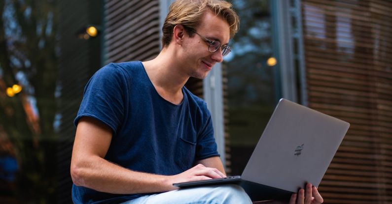 Pc - Selective Focus Photo of Man Using Laptop