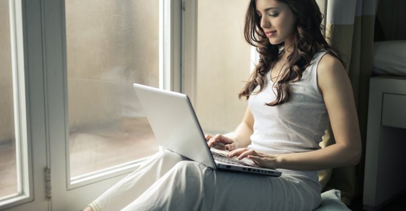 Pc - Woman Wearing Tank Top Sitting by the Window