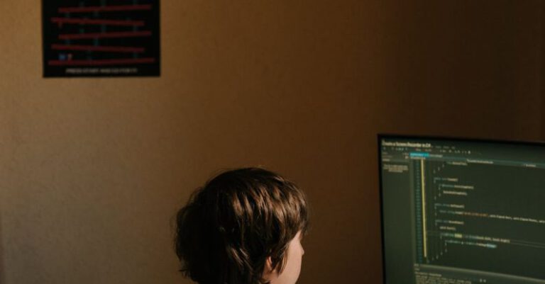 PHP Code - Boy in White Shirt Sitting on Chair