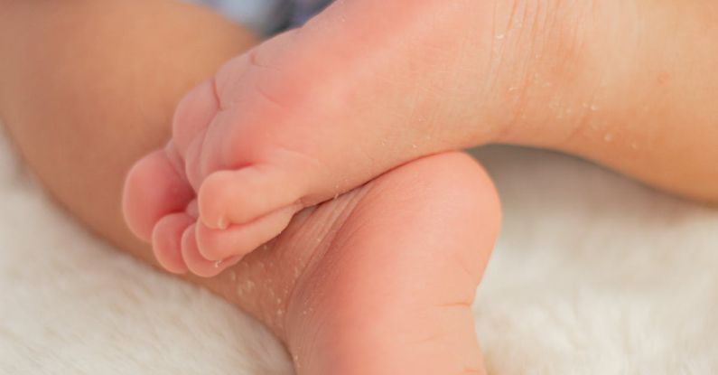Vulnerabilities - A baby's feet are shown in a close up