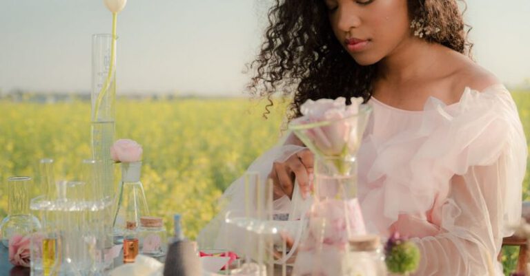 API Testing - Young Woman in Airy Summer Dress Creating Perfumes in Flower Field Laboratory