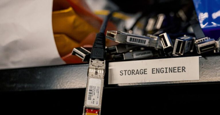 Database Security - Low angle of various connectors and USB cables placed on shelf with storage engineer inscription