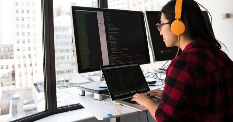 Coding - Woman Sitting in Front Laptop