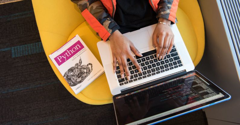 Coding - Woman Programming on a Notebook